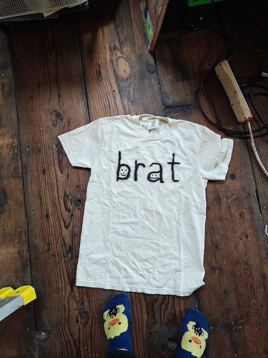 POORLY TIMED BRAT TEE size small